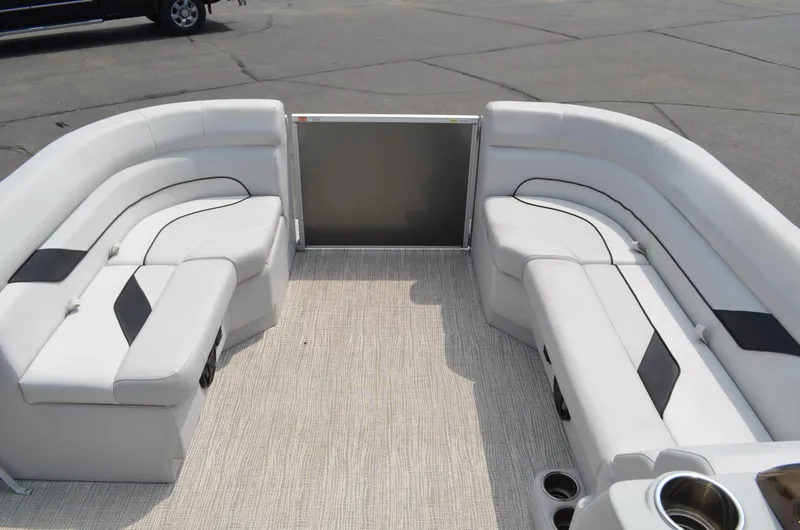 Slide: The Image of 2021 SunCatcher Select Series 20c pontoon boat interior with white seating and cup holders. - 6