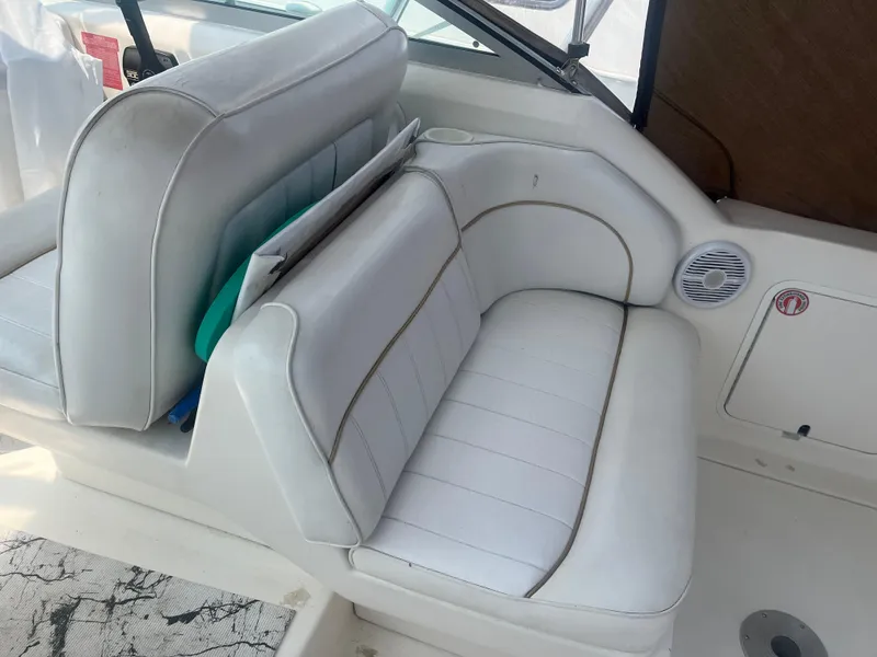 Slide: The Image of White leather seating on 1998 Sea Ray 27 Sundancer boat. - 2