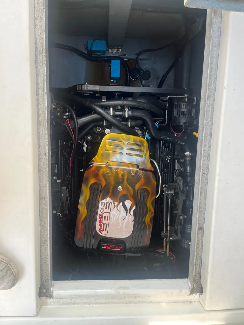 Slide: The Image of Engine compartment of a 1998 Sea Ray 27 Sundancer boat with custom flame design. - 5