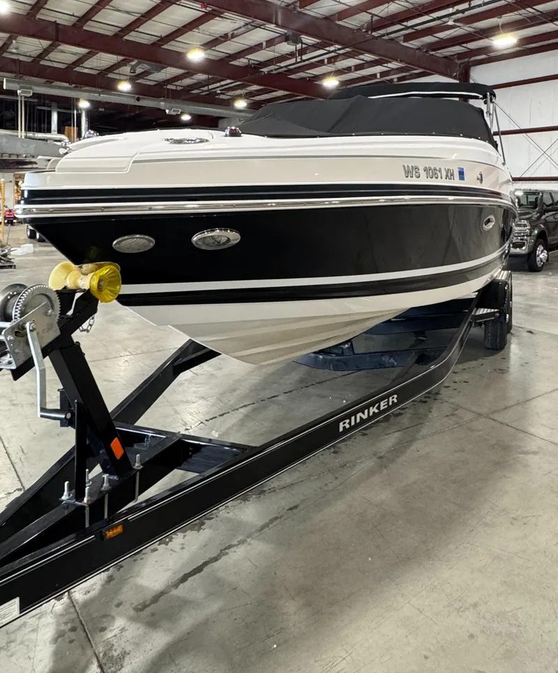 Slide: The Image of 2013 Rinker 276 Captiva Bowrider on trailer in indoor storage facility. - 13