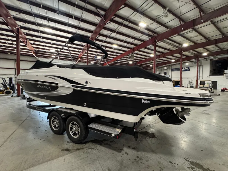 Slide: The Image of 2013 Rinker 276 Captiva Bowrider boat in warehouse on trailer. - 16