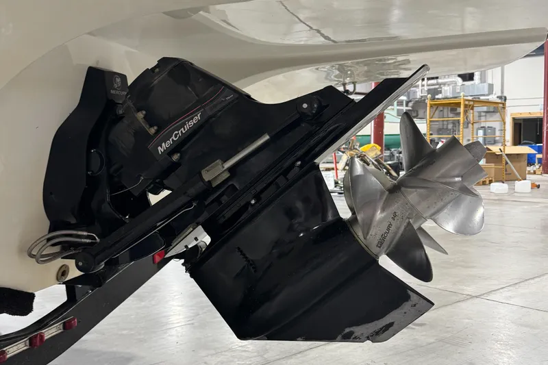 Slide: The Image of 2013 Rinker 276 Captiva Bowrider with MerCruiser outdrive in a workshop. - 18