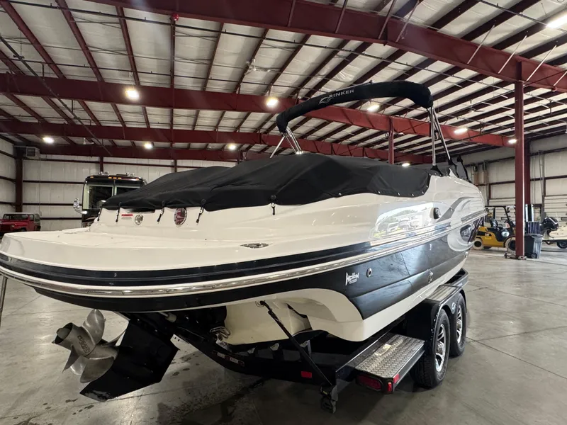 Slide: The Image of 2013 Rinker 276 Captiva Bowrider boat in storage facility on trailer. - 20