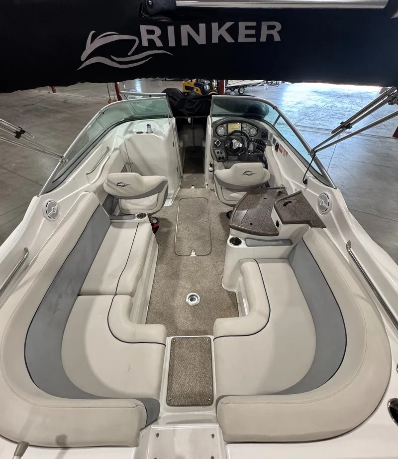 Slide: The Image of 2013 Rinker 276 Captiva Bowrider interior with spacious seating and modern dashboard. - 22