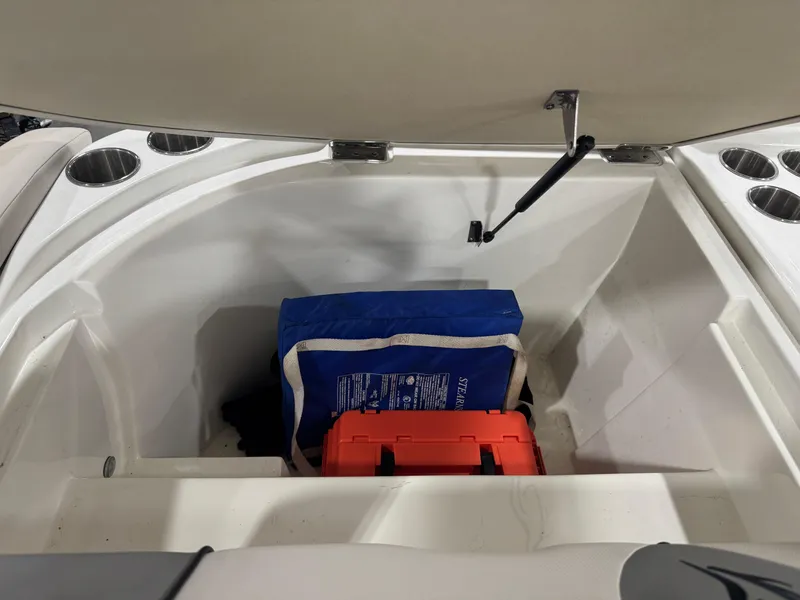 Slide: The Image of Storage compartment of 2013 Rinker 276 Captiva Bowrider with safety gear. - 26