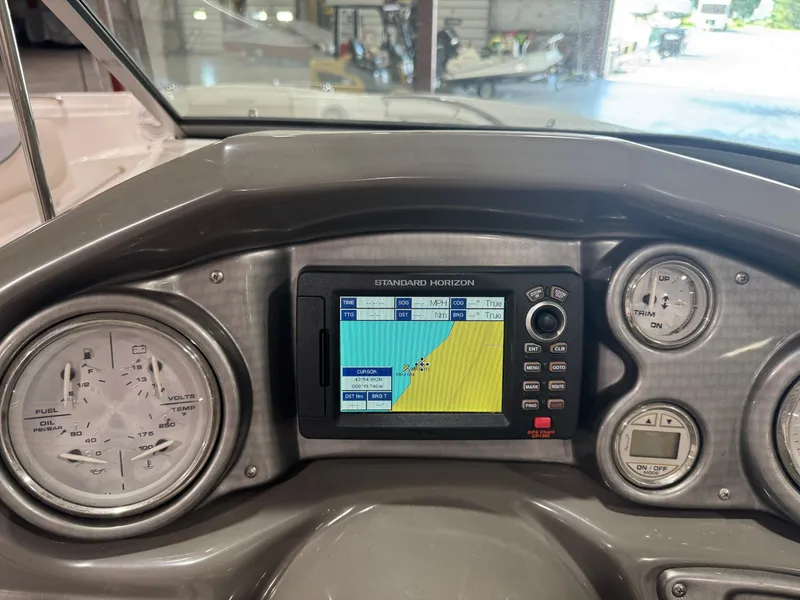 Slide: The Image of Dashboard of 2013 Rinker 276 Captiva Bowrider with navigation system and gauges. - 36
