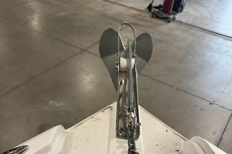 Slide: The Image of 2013 Rinker 276 Captiva Bowrider anchor detail in a garage setting. - 45