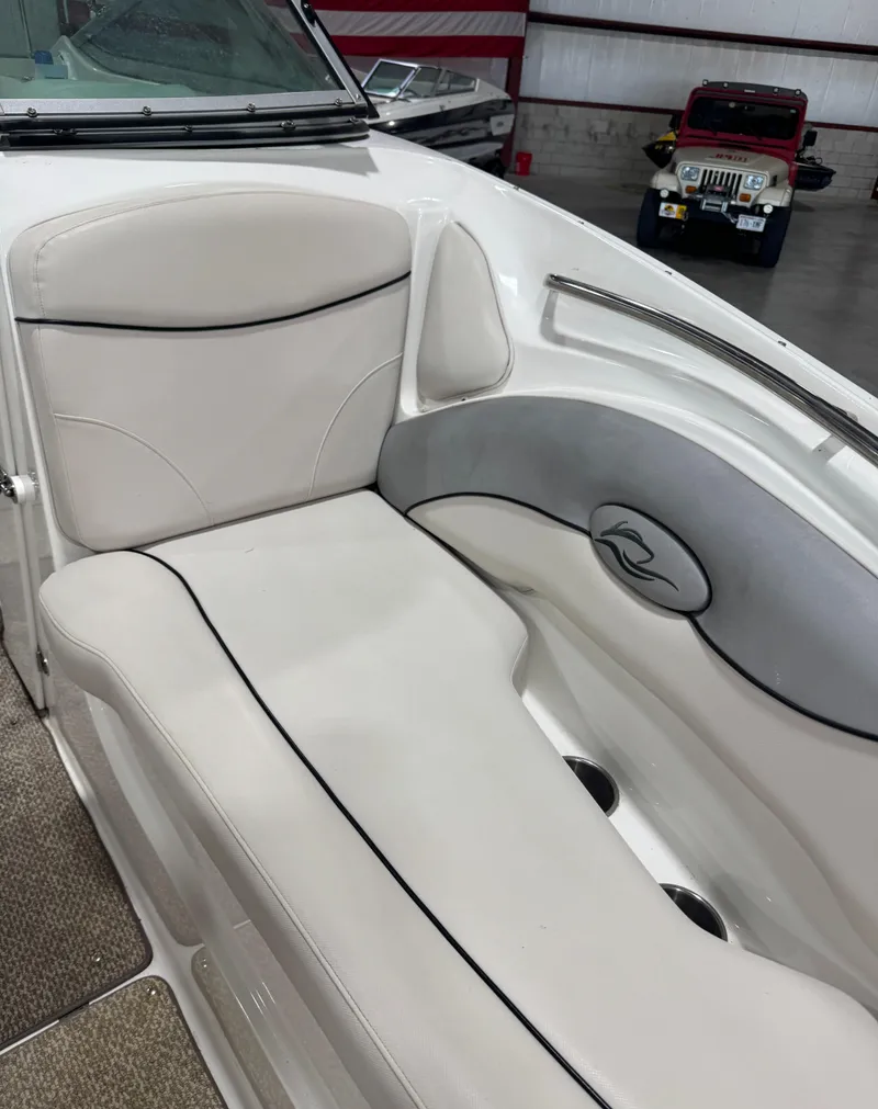 Slide: The Image of 2013 Rinker 276 Captiva Bowrider interior with white seating and sleek design. - 49