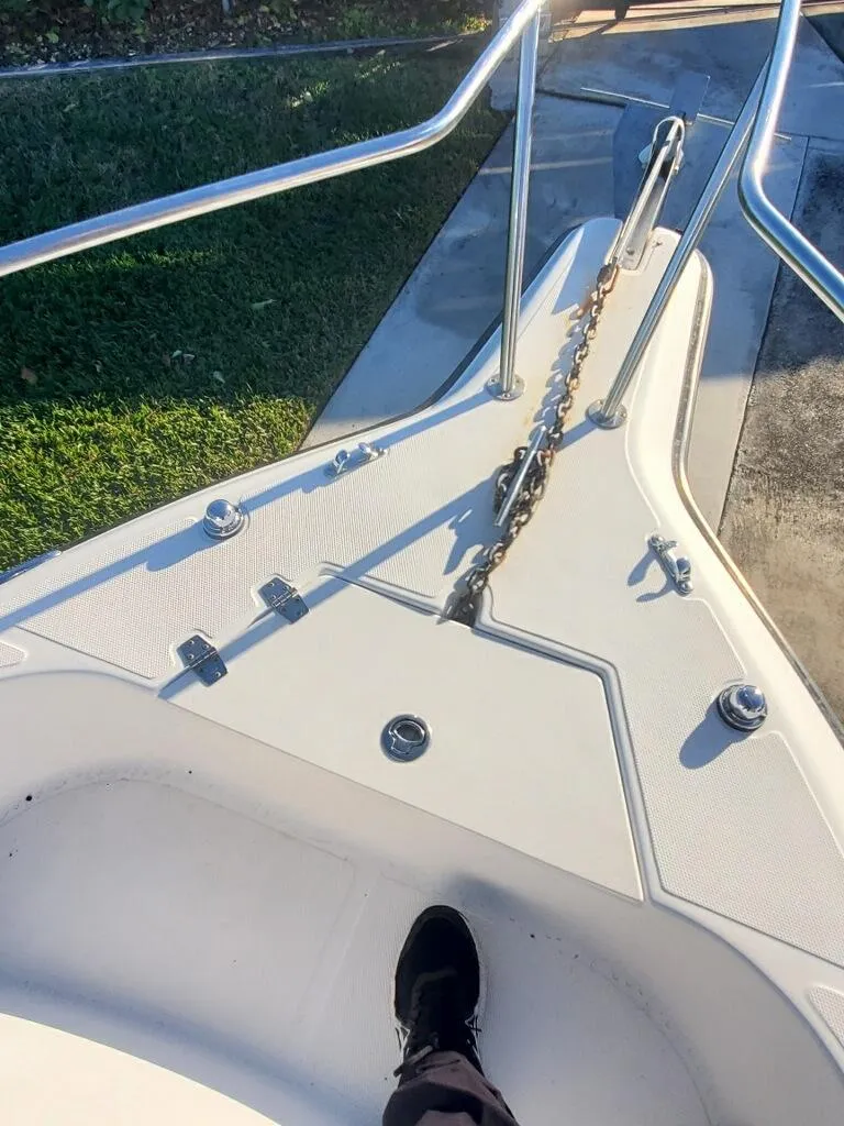 Slide: The Image of 2003 Century 24 Walkaround boat deck with railing and anchor chain. - 7
