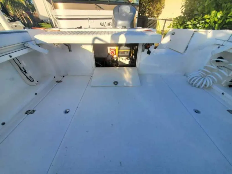 Slide: The Image of 2003 Century 24 Walkaround boat interior with open storage compartment. - 8