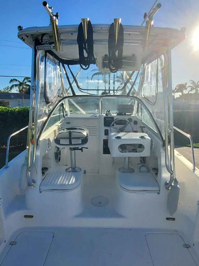 Slide: The Image of 2003 Century 24 Walkaround boat interior with helm and seating. - 9