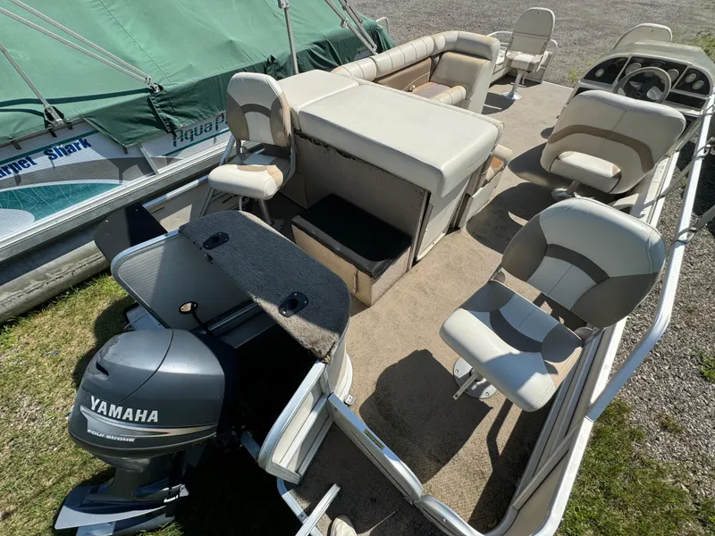 Slide: The Image of Sweetwater 2020DF pontoon boat, 2005 model, with Yamaha motor and beige seating. - 4