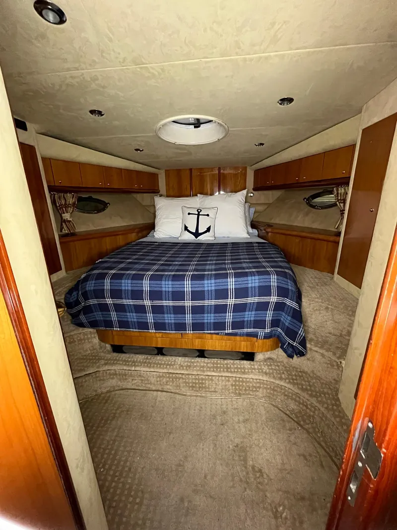 Slide: The Image of Luxurious cabin interior of 2002 Sunseeker Predator 61 yacht with plaid bedding. - 10