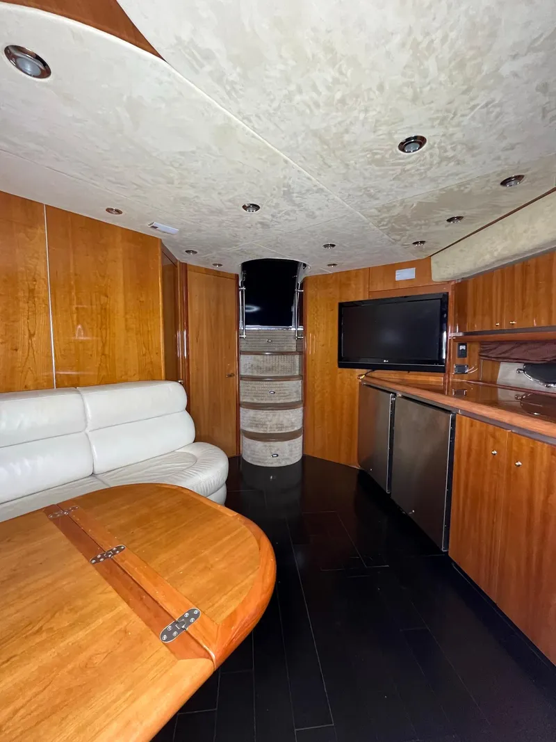 Slide: The Image of Luxurious interior of 2002 Sunseeker Predator 61 yacht with wood finishes and modern amenities. - 15