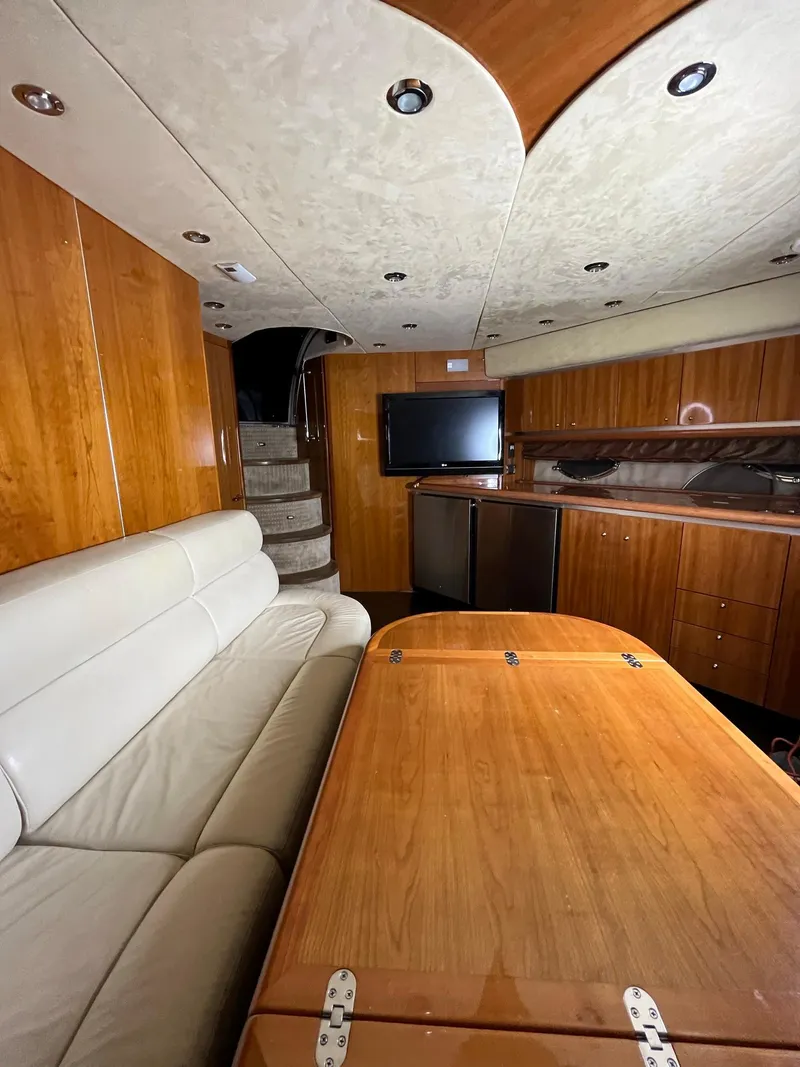 Slide: The Image of Luxurious interior of 2002 Sunseeker Predator 61 yacht with wood finishes and modern amenities. - 16