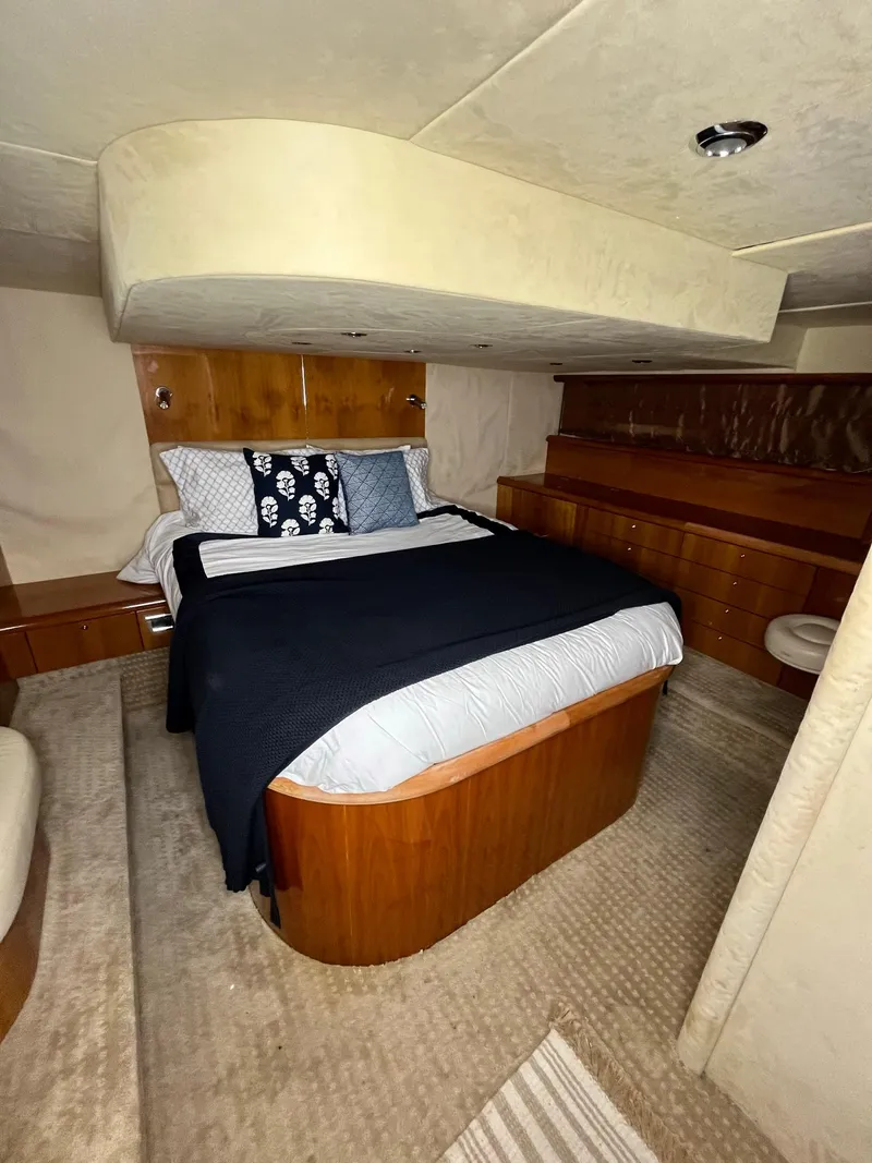Slide: The Image of Luxurious bedroom interior of 2002 Sunseeker Predator 61 yacht with elegant wood finishes. - 18