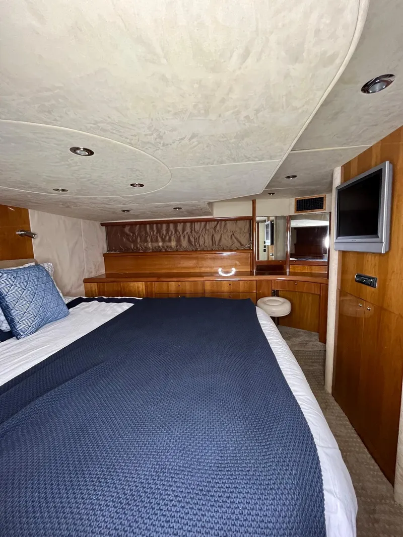 Slide: The Image of Luxurious cabin interior of 2002 Sunseeker Predator 61 yacht with modern amenities. - 19