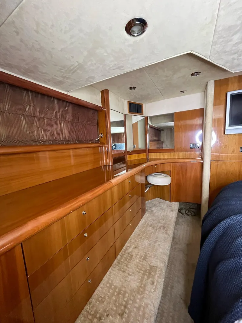 Slide: The Image of Luxurious interior of 2002 Sunseeker Predator 61 yacht with wooden cabinetry and modern design. - 22