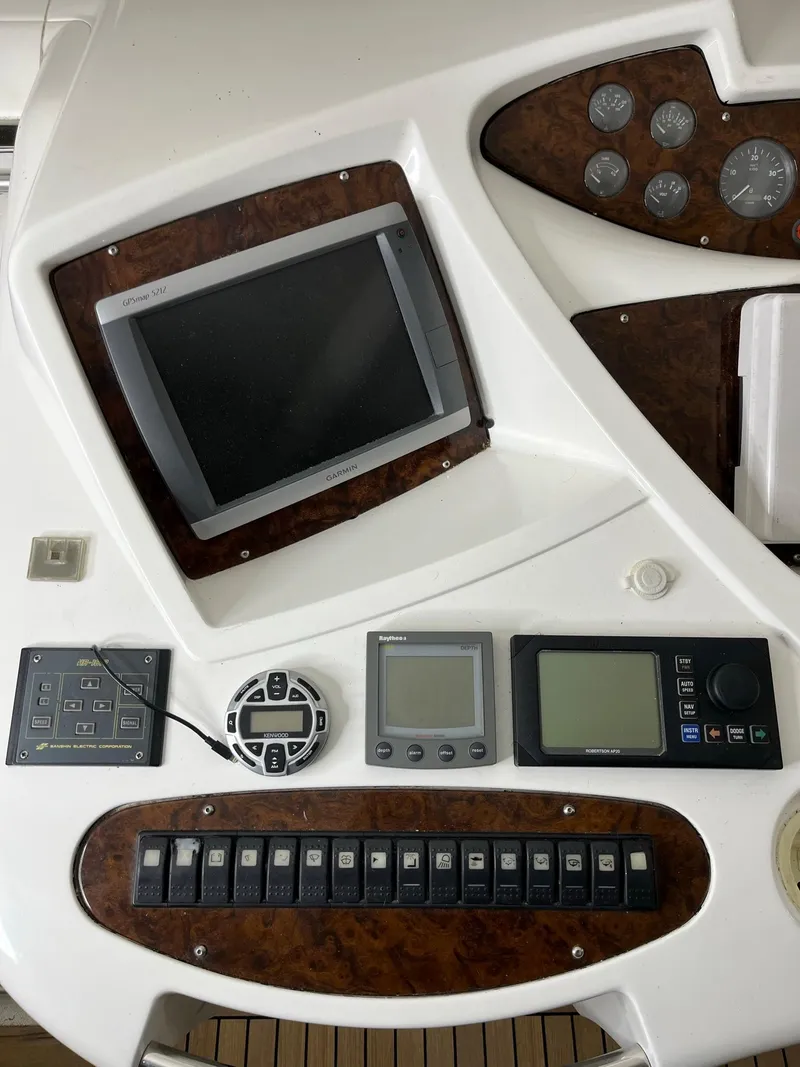 Slide: The Image of Sunseeker Predator 61 yacht dashboard with navigation controls and instruments, 2002 model. - 25
