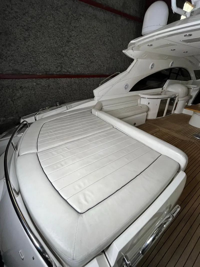 Slide: The Image of 2002 Sunseeker Predator 61 yacht with spacious deck and luxurious seating. - 30