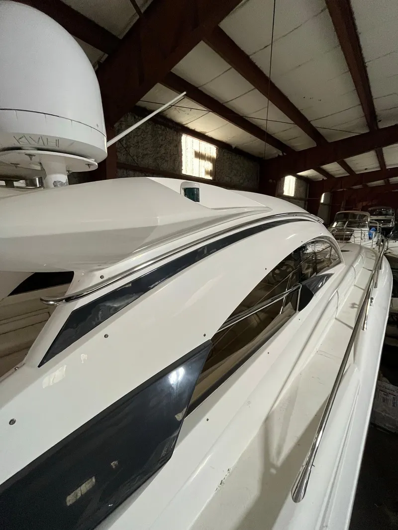 Slide: The Image of 2002 Sunseeker Predator 61 yacht in storage, showcasing sleek design and modern features. - 32