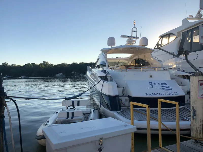 Slide: The Image of 2002 Sunseeker Predator 61 yacht docked at marina during sunset. - 4