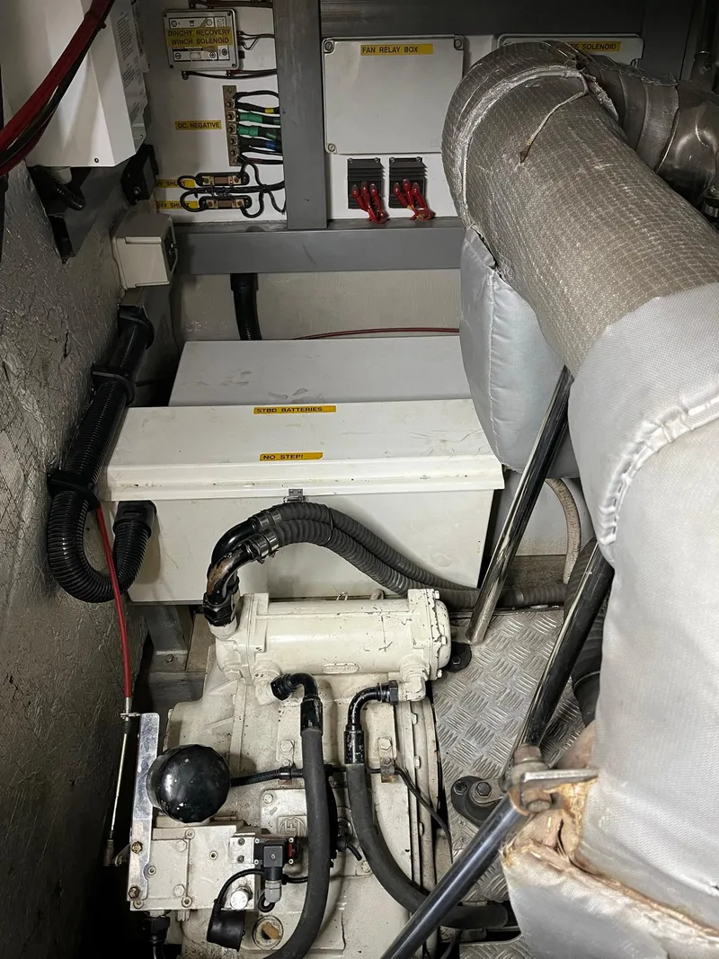 Slide: The Image of Engine room of 2002 Sunseeker Predator 61 yacht, showing mechanical components and wiring. - 40