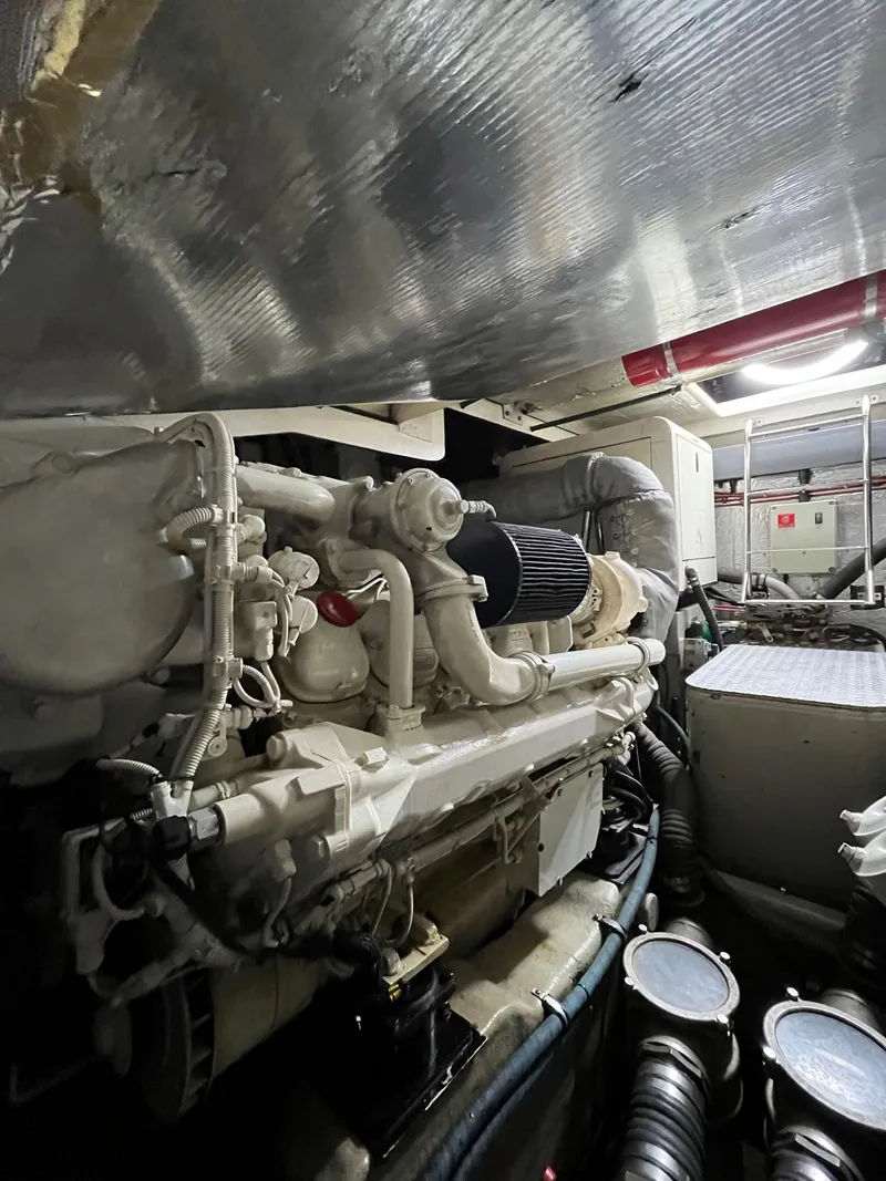 Slide: The Image of Engine room of 2002 Sunseeker Predator 61 yacht, showcasing mechanical components. - 43