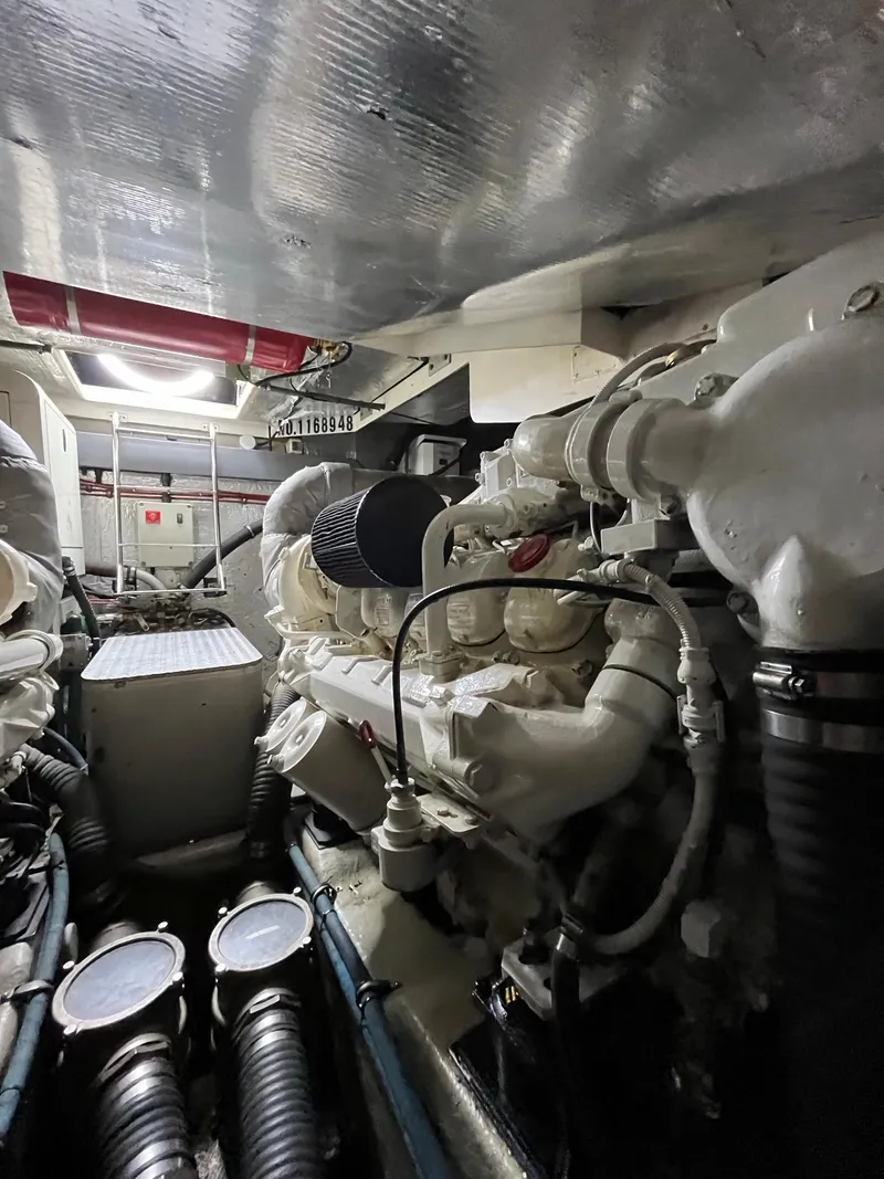 Slide: The Image of Engine room of 2002 Sunseeker Predator 61 yacht, showcasing powerful machinery and components. - 44