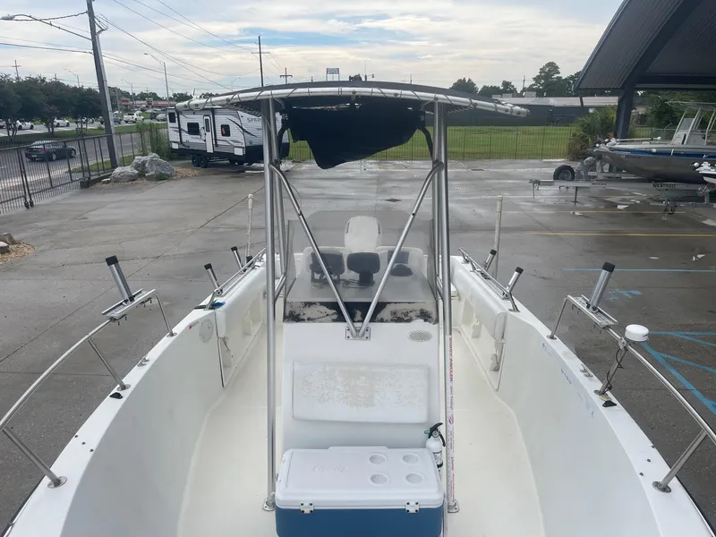 Slide: The Image of 2000 Hydra-Sports 212 Seahorse boat with T-top in parking lot. - 10