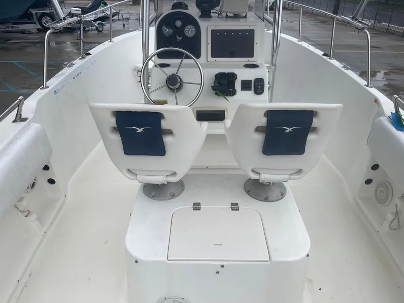 Slide: The Image of 2000 Hydra-Sports 212 Seahorse boat interior with dual seats and steering console. - 11