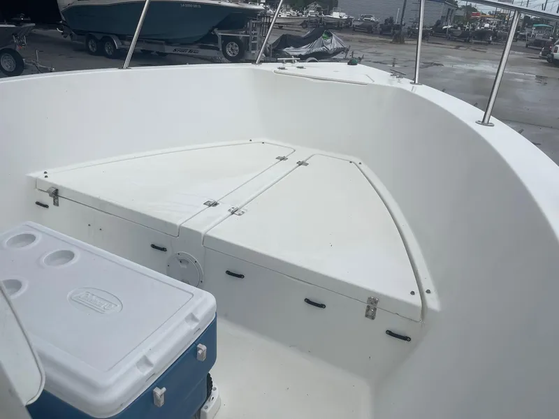 Slide: The Image of 2000 Hydra-Sports 212 Seahorse boat interior with storage and cooler. - 14