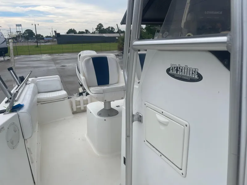 Slide: The Image of 2000 Hydra-Sports 212 Seahorse boat interior with seating and console. - 15