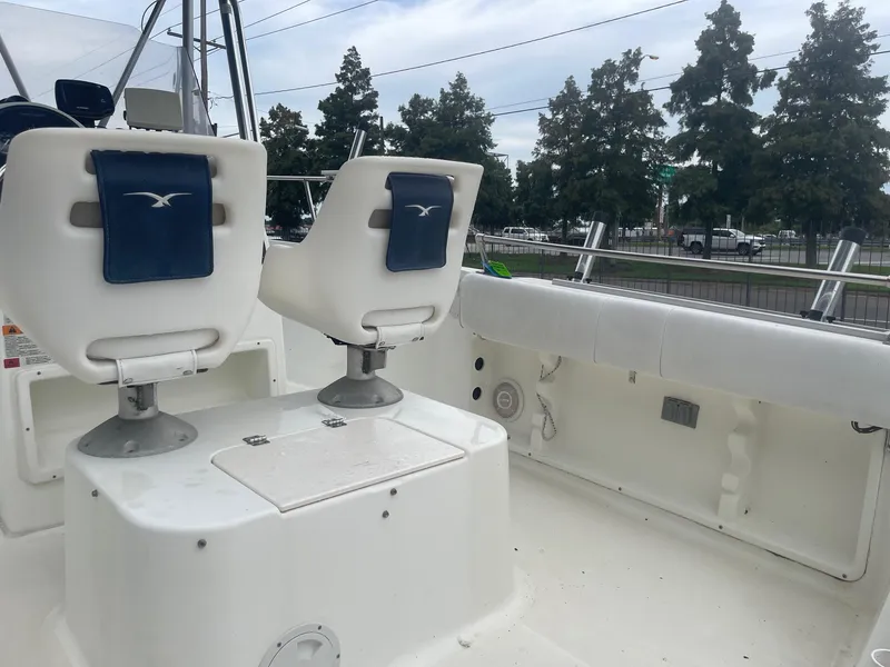 Slide: The Image of 2000 Hydra-Sports 212 Seahorse boat interior with white seating and console. - 18