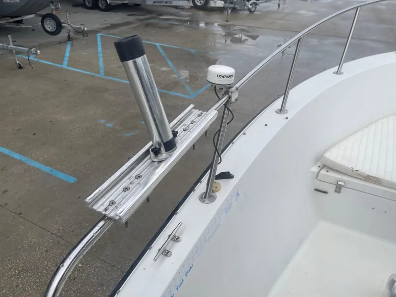 Slide: The Image of Hydra-Sports 212 Seahorse 2000 boat with rod holder and Lowrance equipment on deck. - 23