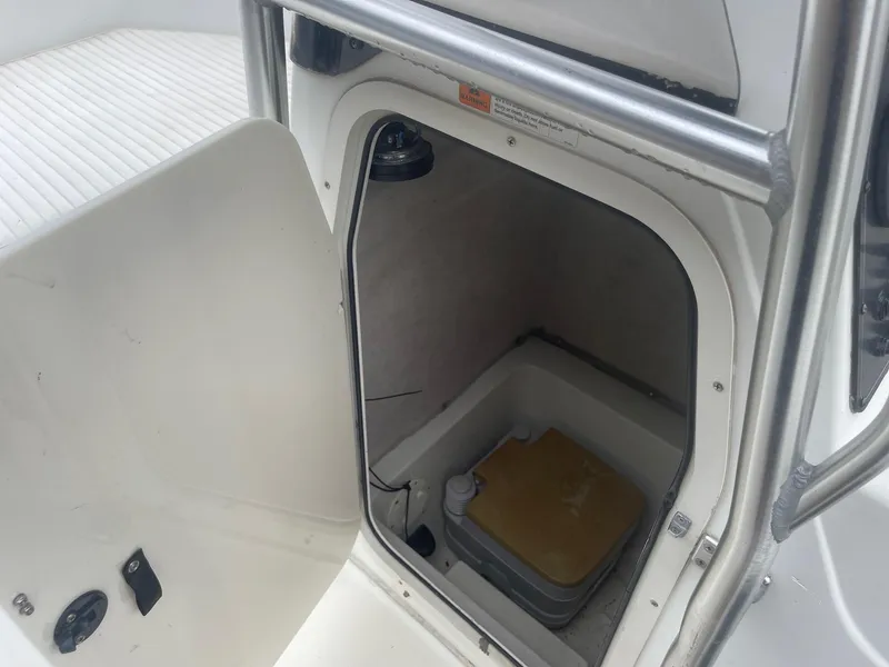 Slide: The Image of 2000 Hydra-Sports 212 Seahorse boat interior with storage compartment. - 24