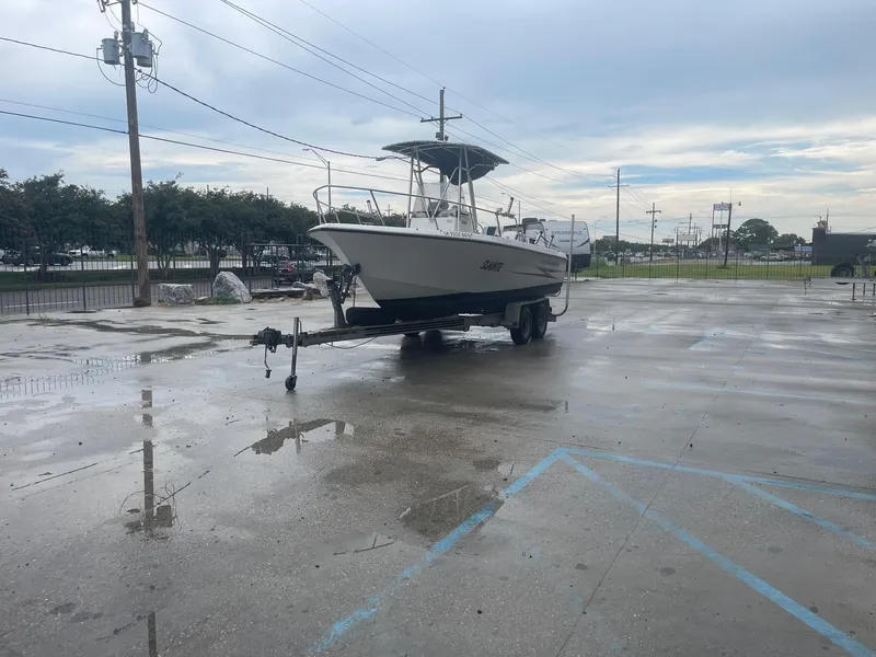 Slide: The Image of 2000 Hydra-Sports 212 Seahorse boat on trailer in parking lot. - 4