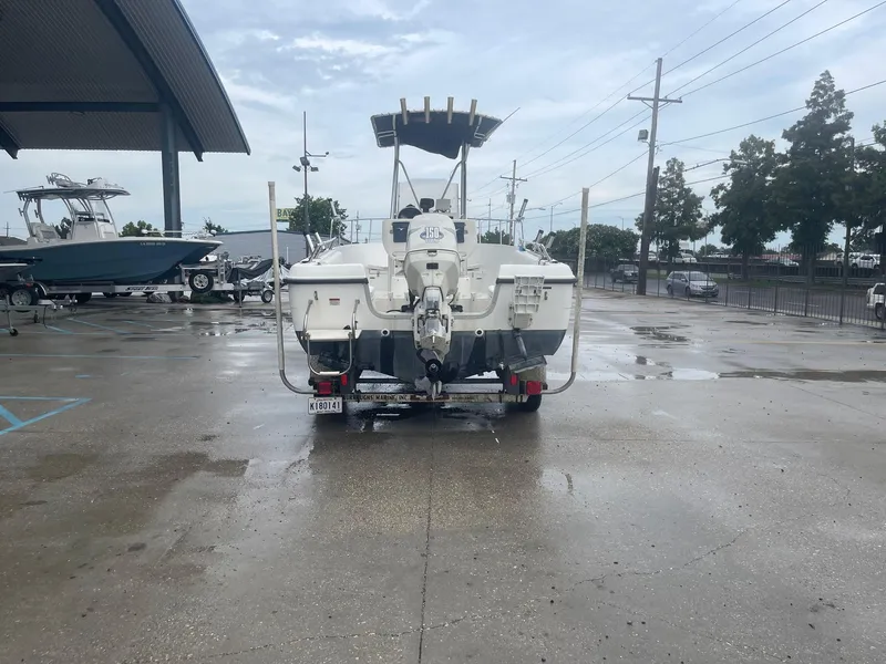 Slide: The Image of 2000 Hydra-Sports 212 Seahorse boat on trailer in marina parking lot. - 7