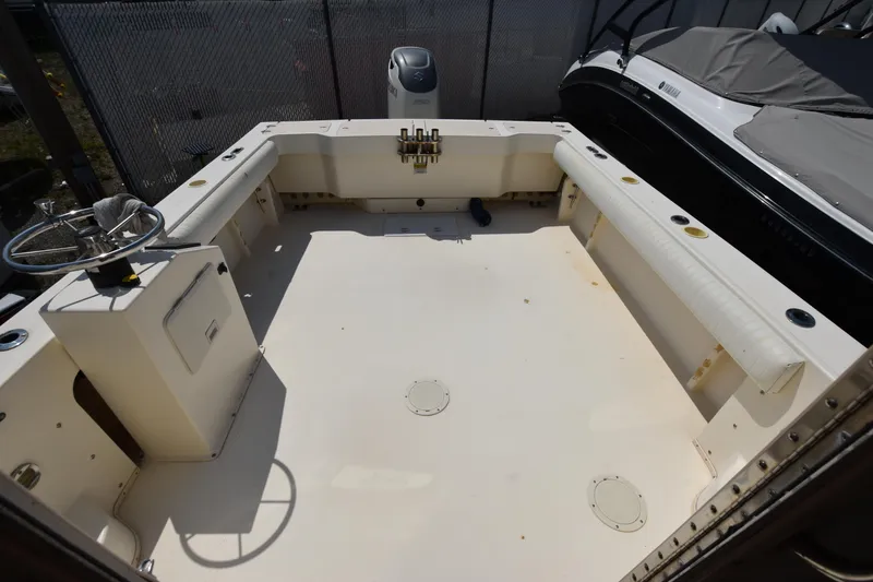 Slide: The Image of 2004 Parker 2520 Deep Vee Sport Cabin boat interior, spacious deck view. - 8