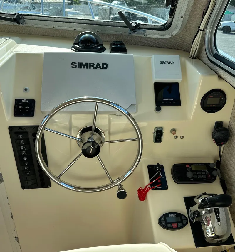 Slide: The Image of Control panel of a 2004 Parker 2520 Deep Vee Sport Cabin boat. - 9