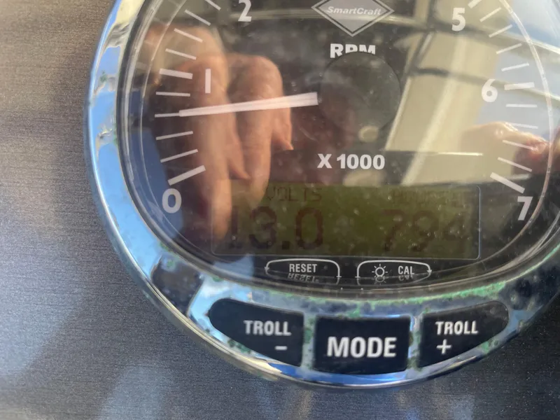 Slide: The Image of RPM gauge on a 2011 ShearWater 25LTZ boat dashboard. - 10