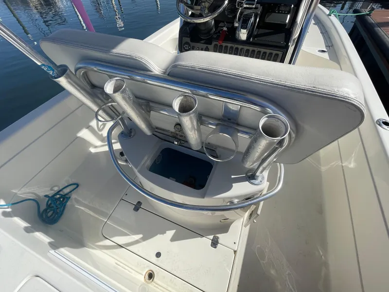 Slide: The Image of 2011 ShearWater 25LTZ boat interior with rod holders and steering console. - 13