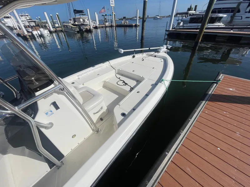 Slide: The Image of 2011 ShearWater 25LTZ boat docked at marina, calm water, clear sky. - 17