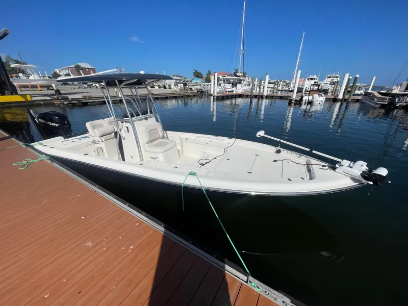 Slide: The Image of 2011 ShearWater 25LTZ boat docked at marina under clear blue sky. - 18