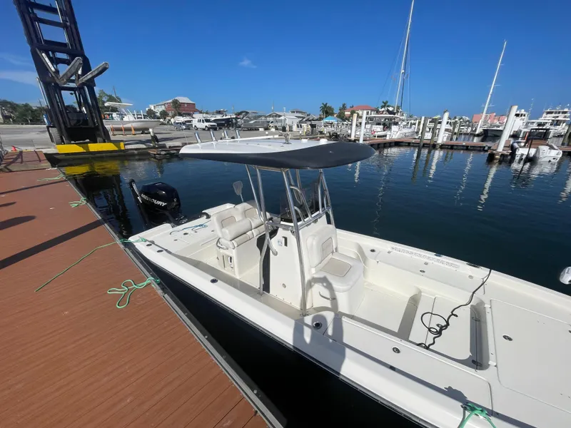 Slide: The Image of 2011 ShearWater 25LTZ boat docked at marina under clear blue sky. - 19