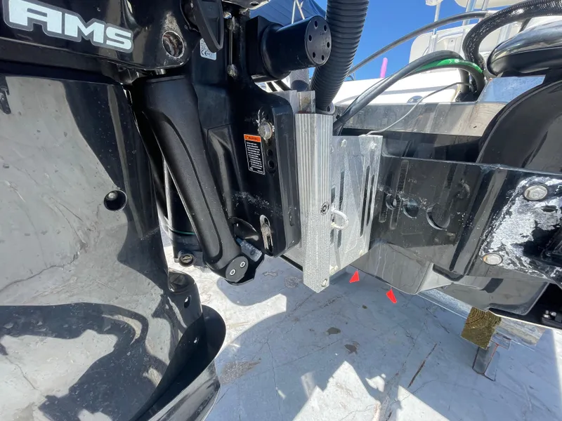 Slide: The Image of Close-up of a 2011 ShearWater 25LTZ boat engine mount and hydraulic system. - 20