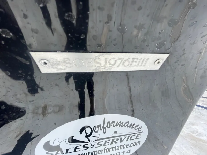 Slide: The Image of 2011 ShearWater 25LTZ boat with identification plate and performance sales sticker. - 6