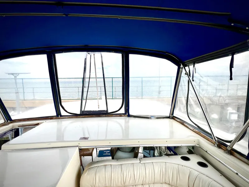 Slide: The Image of Interior view of 1986 Chris-Craft 480 Corinthian yacht with blue canopy. - 29