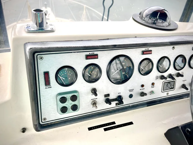 Slide: The Image of Control panel of 1986 Chris-Craft 480 Corinthian boat with gauges and switches. - 35