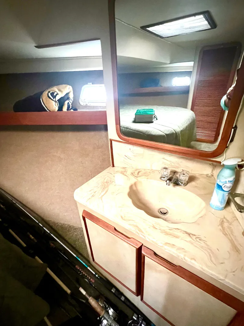 Slide: The Image of 1986 Chris-Craft 480 Corinthian yacht interior with sink and mirror. - 46